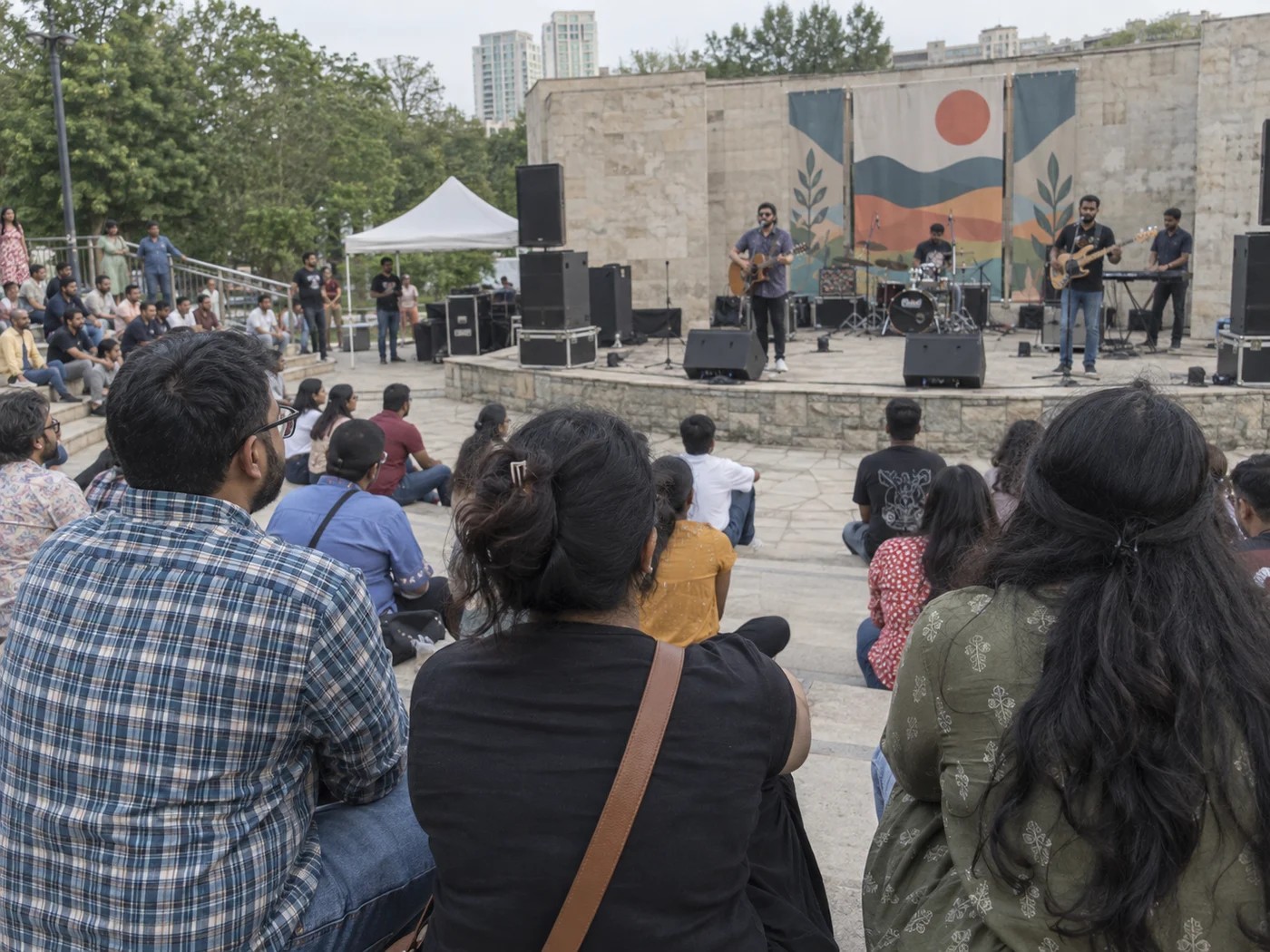A group watching a live outdoor performance